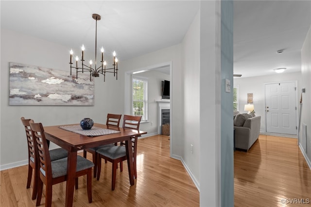 11441 Alder Glen Way, Glen Allen, VA 23059 - dining room featuring light wood-style floors, a chandelier, plenty of natural light, and baseboards