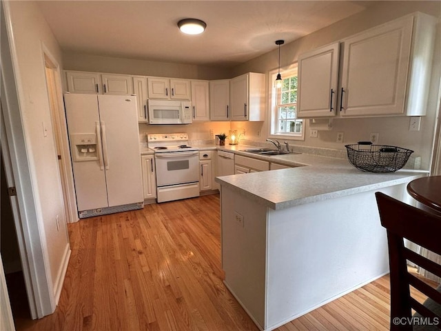 11441 Alder Glen Way, Glen Allen, VA 23059 - kitchen with white appliances, a sink, a peninsula, and light wood-style flooring