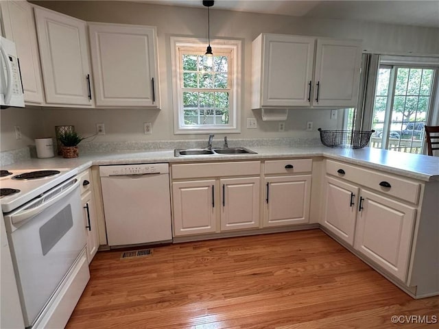 11441 Alder Glen Way, Glen Allen, VA 23059 - kitchen featuring white appliances, a sink, a peninsula, and white cabinetry