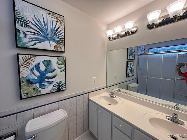 11441 Alder Glen Way, Glen Allen, VA 23059 - bathroom with toilet, tile walls, a stall shower, double vanity, and wainscoting