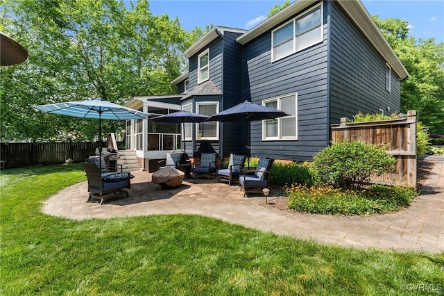 11602 Hardwood Dr, Midlothian, VA 23114 - rear view of property featuring a patio, a sunroom, and an outdoor fire pit