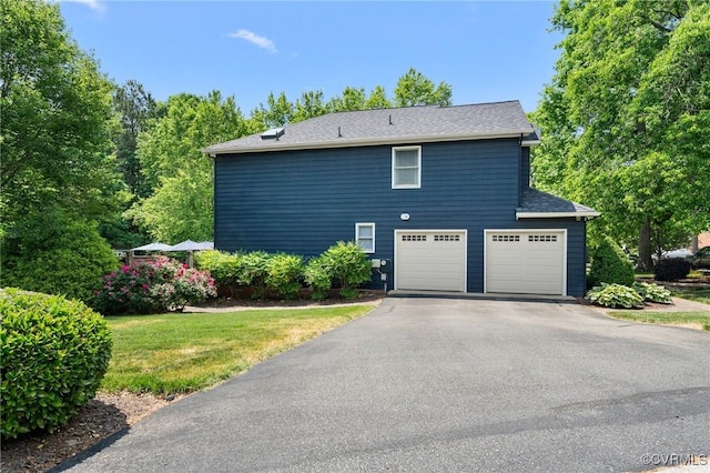 11602 Hardwood Dr, Midlothian, VA 23114 - view of side of property featuring driveway and an attached garage