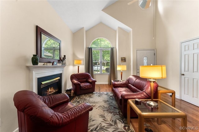 11602 Hardwood Dr, Midlothian, VA 23114 - living area featuring a glass covered fireplace, wood finished floors, lofted ceiling, baseboards, and a ceiling fan