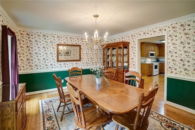 4329 Stebbins St, Chester, VA 23831 - dining room featuring wallpapered walls, light wood-style flooring, a chandelier, crown molding, and baseboards