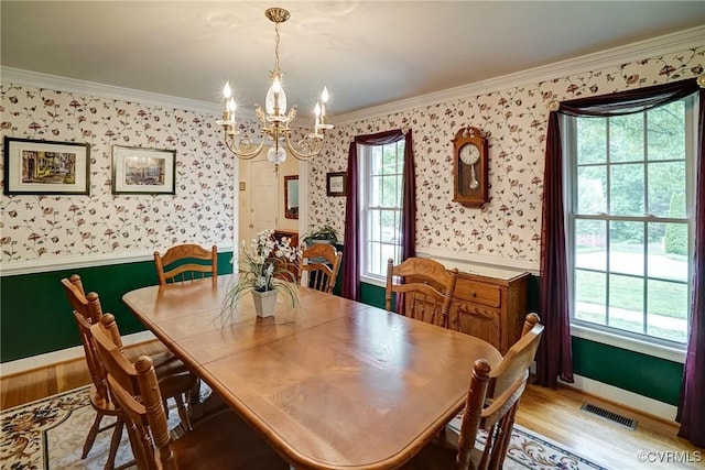 4329 Stebbins St, Chester, VA 23831 - dining space featuring a chandelier, wallpapered walls, ornamental molding, light wood-style flooring, and baseboards