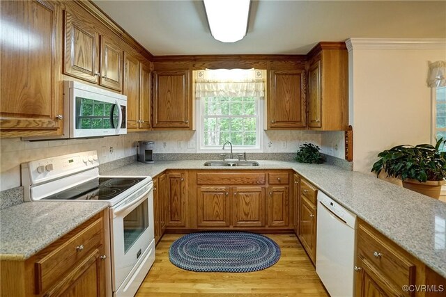 4329 Stebbins St, Chester, VA 23831 - kitchen featuring white appliances, a sink, and brown cabinetry