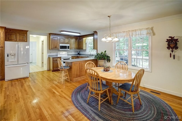 4329 Stebbins St, Chester, VA 23831 - dining room with crown molding, light wood-style floors, a chandelier, and baseboards