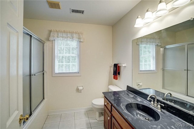 4329 Stebbins St, Chester, VA 23831 - full bath featuring toilet, tile patterned flooring, vanity, baseboards, and enclosed tub / shower combo