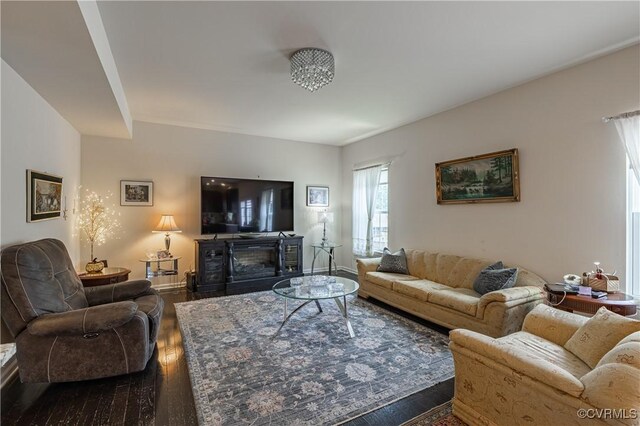8421 Eden St, Henrico, VA 23228 - living room with wood finished floors, baseboards, and a glass covered fireplace