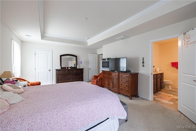 8421 Eden St, Henrico, VA 23228 - bedroom featuring crown molding, light carpet, a tray ceiling, and ensuite bath