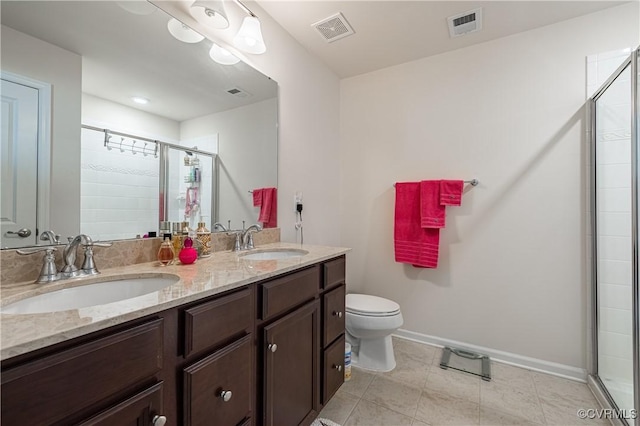 8421 Eden St, Henrico, VA 23228 - full bathroom with a stall shower, baseboards, toilet, and double vanity