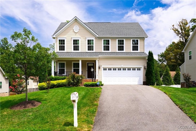 8421 Eden St, Henrico, VA 23228 - traditional-style house with asphalt driveway, covered porch, an attached garage, and a front yard