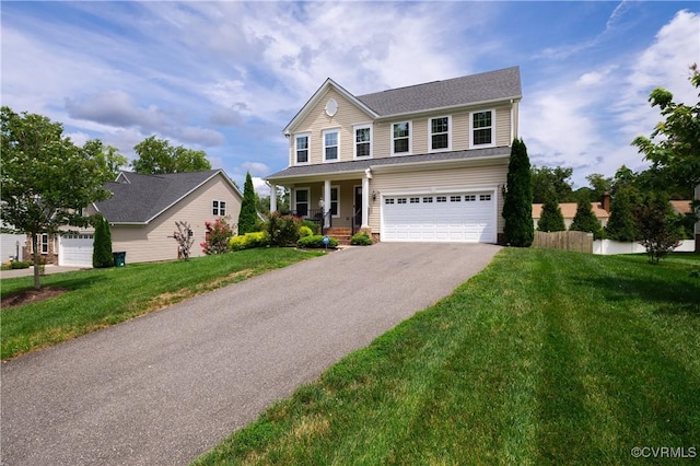 8421 Eden St, Henrico, VA 23228 - view of front of home featuring asphalt driveway, a porch, a garage, and a front yard