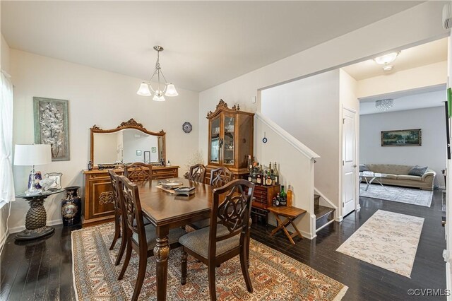 8421 Eden St, Henrico, VA 23228 - dining room featuring stairway, dark wood finished floors, a chandelier, and baseboards