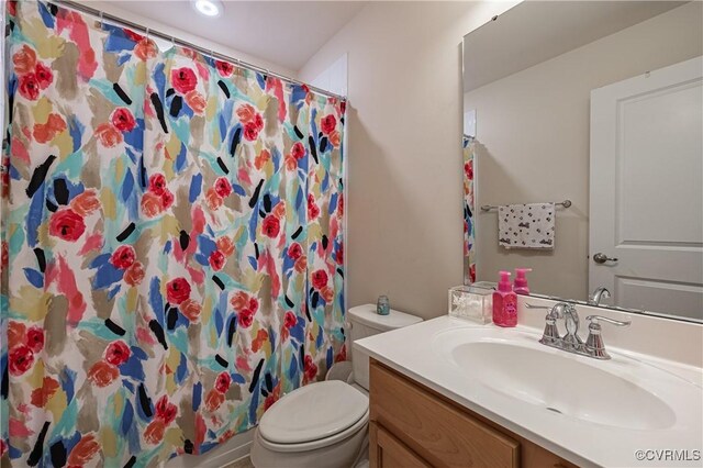 8421 Eden St, Henrico, VA 23228 - bathroom with toilet, vanity, and a shower with curtain