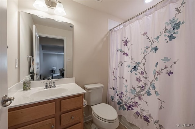 8421 Eden St, Henrico, VA 23228 - bathroom featuring vanity, toilet, and curtained shower
