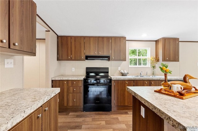 15011 Elm Cottage Rd, Amelia Courthouse, VA 23002 - kitchen featuring black range with electric cooktop, exhaust hood, wood finished floors, brown cabinetry, and recessed lighting
