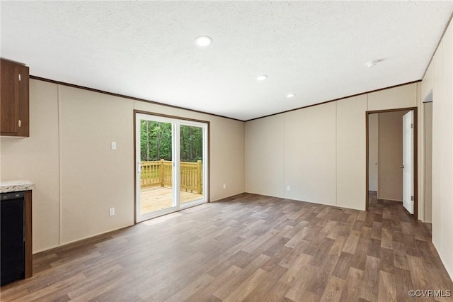 15011 Elm Cottage Rd, Amelia Courthouse, VA 23002 - unfurnished living room with wood finished floors, recessed lighting, a textured ceiling, and crown molding