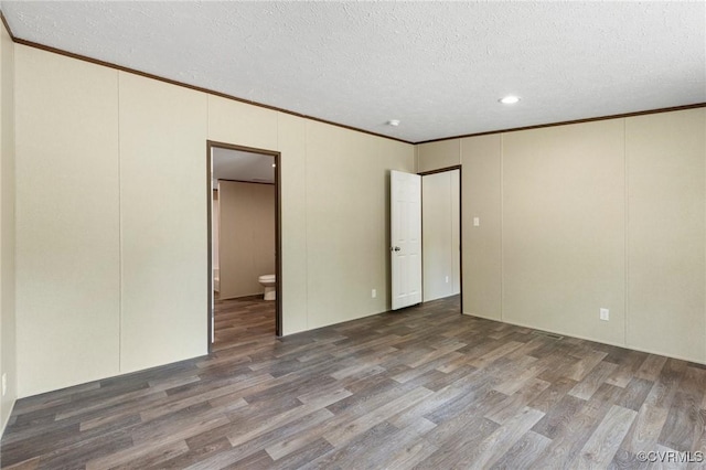 15011 Elm Cottage Rd, Amelia Courthouse, VA 23002 - unfurnished bedroom featuring wood finished floors, ornamental molding, a textured ceiling, a decorative wall, and ensuite bathroom