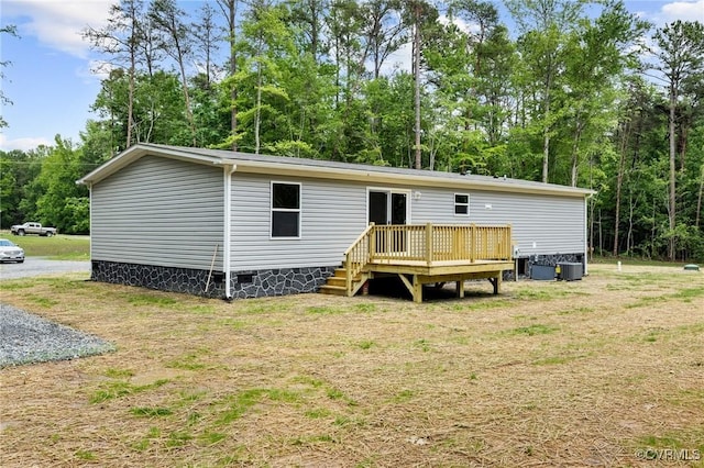 15011 Elm Cottage Rd, Amelia Courthouse, VA 23002 - rear view of house with a wooden deck, crawl space, a lawn, and central AC