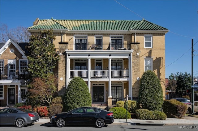 601 Roseneath Rd Unit U11, Richmond, VA 23221 - view of property with a tile roof, a balcony, and brick siding