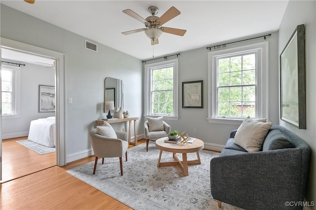 601 Roseneath Rd Unit U11, Richmond, VA 23221 - living room with wood finished floors, a ceiling fan, and baseboards