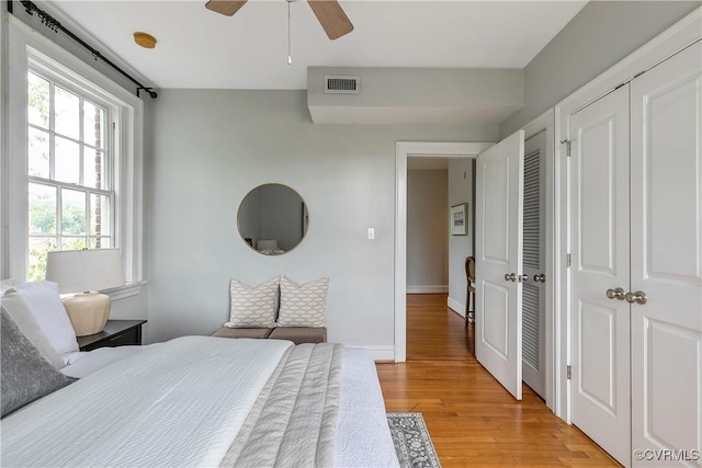 601 Roseneath Rd Unit U11, Richmond, VA 23221 - bedroom featuring light wood-type flooring, a closet, baseboards, and a ceiling fan