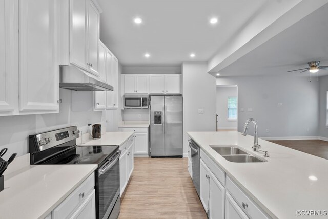 8136 Fedora Dr, Chesterfield, VA 23838 - kitchen featuring appliances with stainless steel finishes, a sink, under cabinet range hood, light wood-type flooring, and a ceiling fan