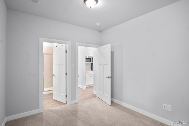 8136 Fedora Dr, Chesterfield, VA 23838 - unfurnished bedroom featuring light colored carpet, baseboards, and connected bathroom