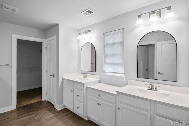 8136 Fedora Dr, Chesterfield, VA 23838 - full bath with wood finished floors, two vanities, baseboards, and a spacious closet