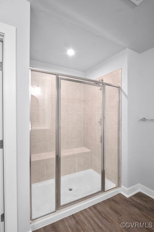 8136 Fedora Dr, Chesterfield, VA 23838 - bathroom featuring a stall shower, wood finished floors, and baseboards