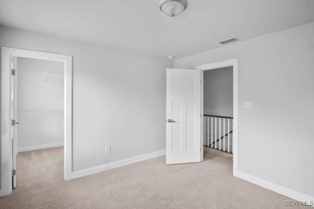 8136 Fedora Dr, Chesterfield, VA 23838 - unfurnished bedroom featuring carpet flooring, a walk in closet, baseboards, and a closet