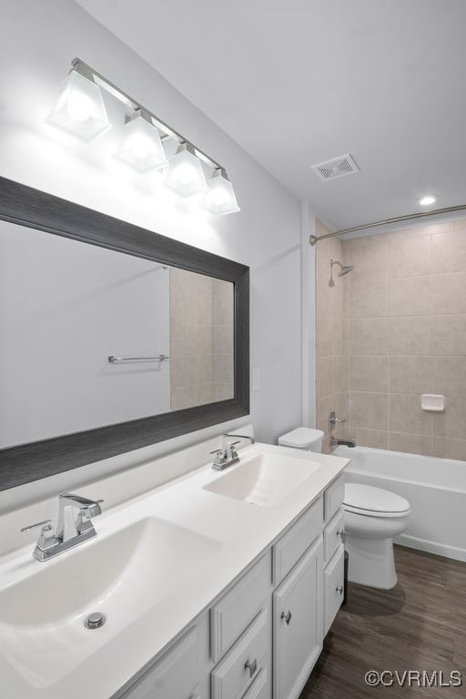 8136 Fedora Dr, Chesterfield, VA 23838 - full bath with wood finished floors, toilet, double vanity, and bathing tub / shower combination