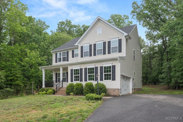 8136 Fedora Dr, Chesterfield, VA 23838 - view of front of home with a garage, covered porch, driveway, and a front yard