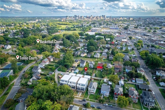 aerial view of property's location featuring nearby urban area