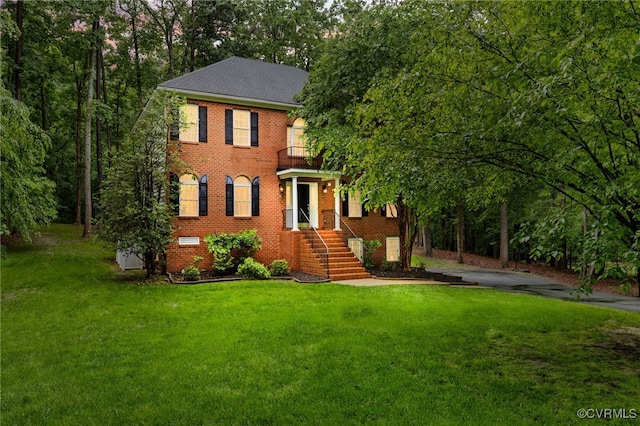 8413 Chandon Ct, Chesterfield, VA 23838 - colonial inspired home with a balcony, a front lawn, and brick siding