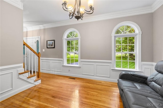 8413 Chandon Ct, Chesterfield, VA 23838 - sitting room featuring a chandelier, healthy amount of natural light, crown molding, stairway, and light wood-type flooring