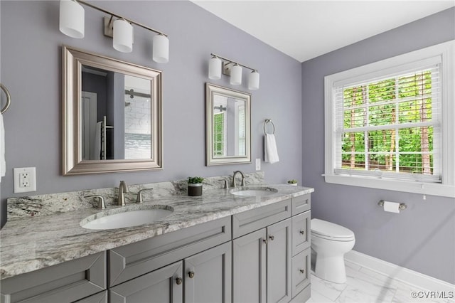 8413 Chandon Ct, Chesterfield, VA 23838 - bathroom featuring marble finish flooring, baseboards, double vanity, and toilet