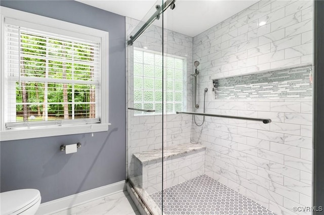 8413 Chandon Ct, Chesterfield, VA 23838 - full bathroom with baseboards, a shower stall, healthy amount of natural light, and marble look tiles