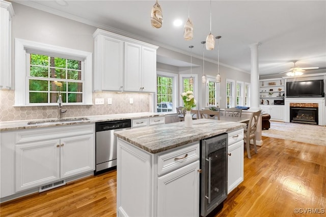 8413 Chandon Ct, Chesterfield, VA 23838 - kitchen featuring dishwasher, a sink, wine cooler, light wood-type flooring, and ornamental molding