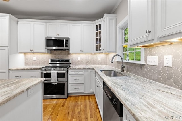 8413 Chandon Ct, Chesterfield, VA 23838 - kitchen featuring stainless steel appliances, a sink, white cabinets, and light wood finished floors