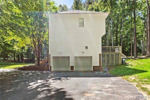 8413 Chandon Ct, Chesterfield, VA 23838 - view of side of property with asphalt driveway, an attached garage, a yard, and a deck