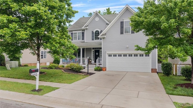 traditional-style home featuring covered porch, a front lawn, an attached garage, and driveway