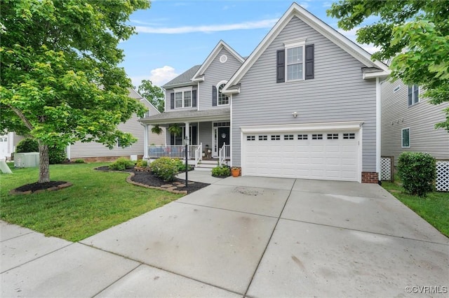 traditional-style home with a porch, an attached garage, a front yard, and driveway