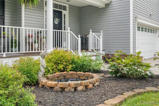 view of yard featuring a fire pit and a garage