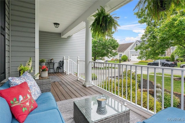wooden terrace featuring a residential view