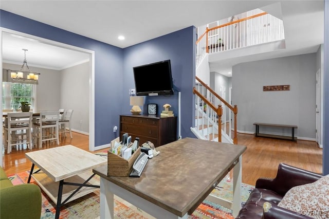 living room featuring a chandelier, stairway, wood finished floors, baseboards, and recessed lighting