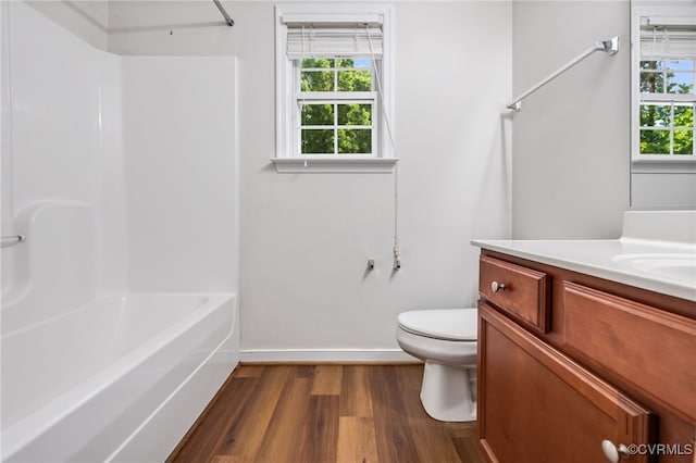 2909 Ginter St, Henrico, VA 23228 - full bathroom featuring toilet, wood finished floors, vanity, baseboards, and bathing tub / shower combination