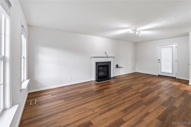 2909 Ginter St, Henrico, VA 23228 - unfurnished living room featuring wood finished floors, a fireplace with flush hearth, and baseboards