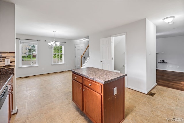 2909 Ginter St, Henrico, VA 23228 - kitchen with dark countertops, decorative backsplash, a center island, a chandelier, and dishwasher